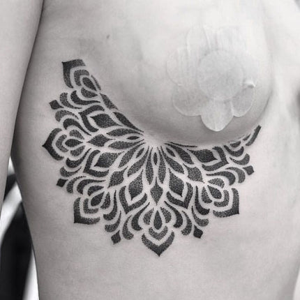 Sternum Dotwork Mandala Tattoo Done by Chris Jones