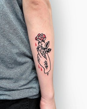 Minimalistic Hand and Rose Tattoo