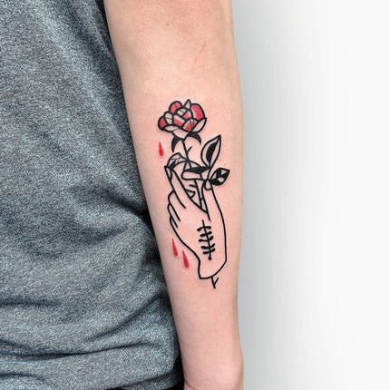 Minimalistic Hand and Rose Tattoo