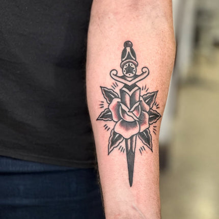 Black Traditional Rose and Dagger Tattoo By Lewis Hussey
