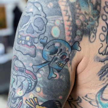 Blast Over Skull Tattoo By Kane Berry