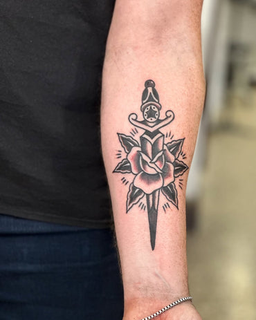 Black Traditional Rose and Dagger Tattoo By Lewis Hussey