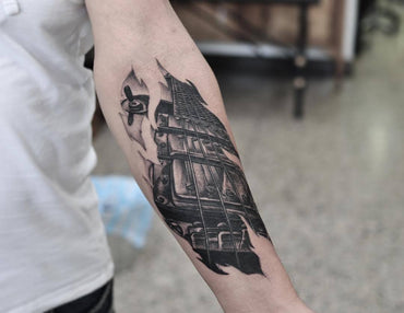 Triple humbucker Les Paul tattoo in black and grey